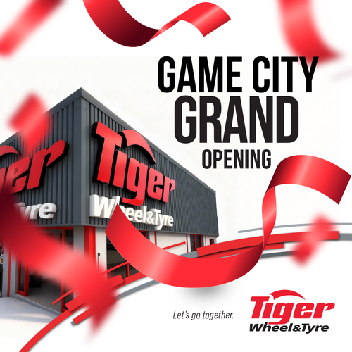 Game City Grand Opening - Tiger Wheel & Tyre branch with red confetti falling around it