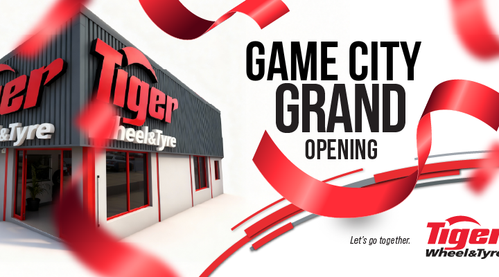 Game City Grand Opening - Tiger Wheel & Tyre branch with red confetti falling around it